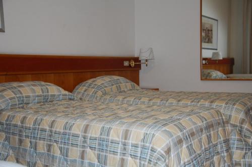 Postel nebo postele na pokoji v ubytování Albergo Ristorante Del Ponte