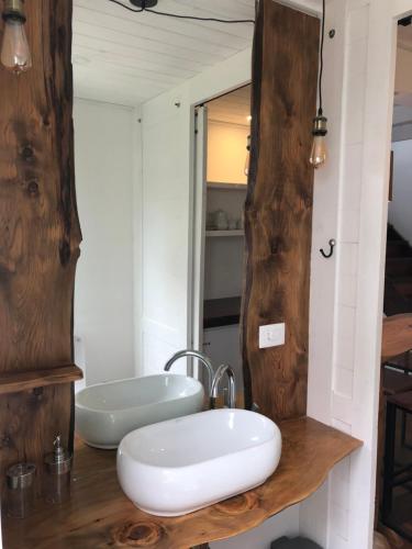 a bathroom with a white sink and a mirror at Punta Ballena Punta del Este in Punta del Este