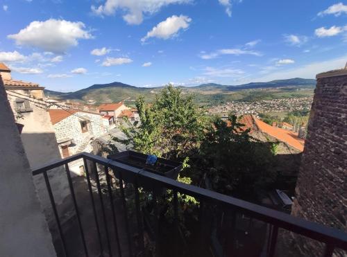 a view of a city from the balcony of a building at Agréable maison de ville avec parking gratuit in Corent