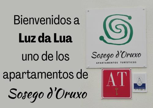 a group of logos on a wall at Luz da Lúa - Casa del campo in Muxia