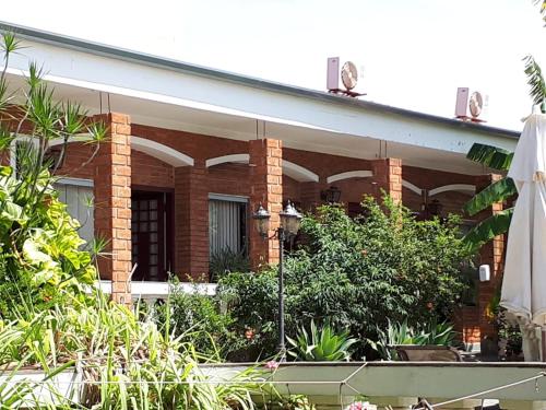 Taman di luar FLATS LENINHA ABREU - não fornecemos roupa de cama e banho, não fornecemos café da manhã