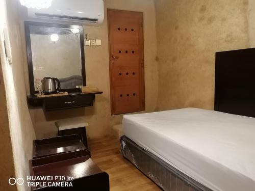 Ένα ή περισσότερα κρεβάτια σε δωμάτιο στο Bait Baityn بيت البيتين