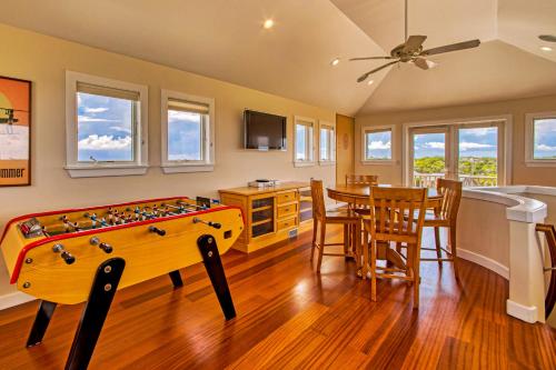 a living room with a pool table and a kitchen at Croatan Ridge 940 in Buxton