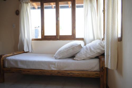 Säng eller sängar i ett rum på ROCA AZUL