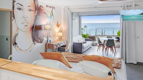 a living room with a view of the ocean at Residence Bleu Marine - Honeymoon apartments in Saint Martin