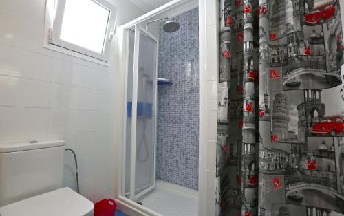 a bathroom with a shower curtain with a car on it at Apartment Vasco de Gama in Telde