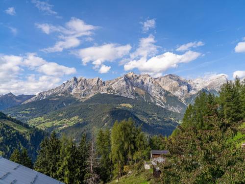 a view of a mountain range with trees and a house at Haus Hauser in Raut