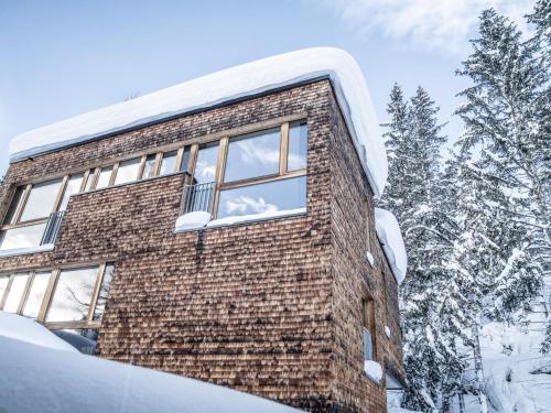a brick building in the snow with trees at Klassik in Burg
