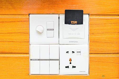 a box with a cell phone on top of a table at The Shahin Residence - Mohakhali in Dhaka
