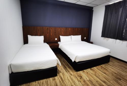 3-Plus Hotelにあるベッド