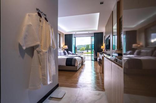 Ένα ή περισσότερα κρεβάτια σε δωμάτιο στο Pim Pool Villa Nan
