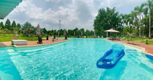 a slide in a swimming pool at a resort at Les Hameaux de l'Orient in Cu Chi