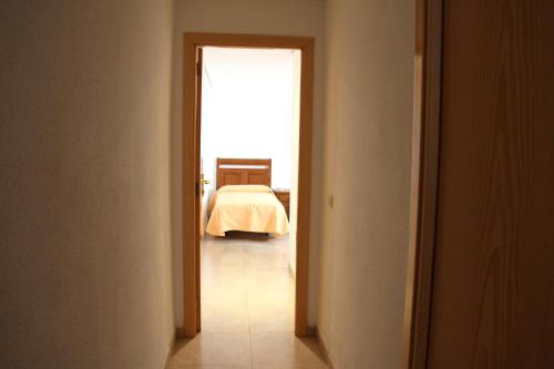 an open hallway with a bed in a bedroom at Hostal Restaurante La Masía in Villareal