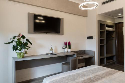 TV a/nebo společenská místnost v ubytování Hotel Casa Tra Noi