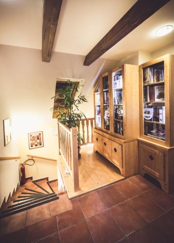 a room with a staircase and a wooden cabinet at Penzion a Restaurace U Johana in Zlín