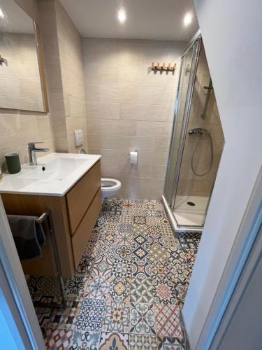 a bathroom with a sink and a shower at Vieux port LA CIOTAT 1 in La Ciotat