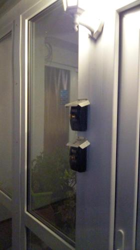 a door with two boxes on the side of a window at Hotel Landhaus Nassau in Meißen