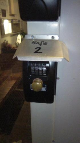 a microwave on the side of a refrigerator at Hotel Landhaus Nassau in Meißen