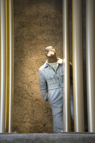a mannequin in a denim suit is behind a window at The Cettia Istanbul in Istanbul