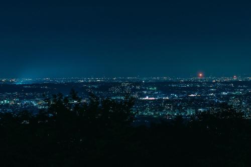 a view of a city at night at Kamenoi Hotel Tondabayashi All-Inclusive Resort in Tondabayashi