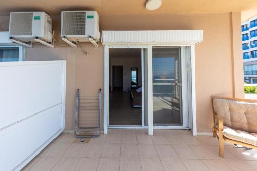 a living room with two air conditioners on the wall at Melis Hotel Kusadasi in Kusadası