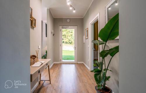 a hallway of a home with a desk and a plant at Al Quadrato in Piobbico