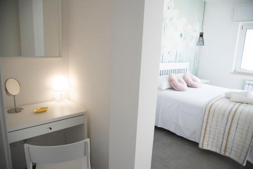 A bed or beds in a room at Perla Vacanza