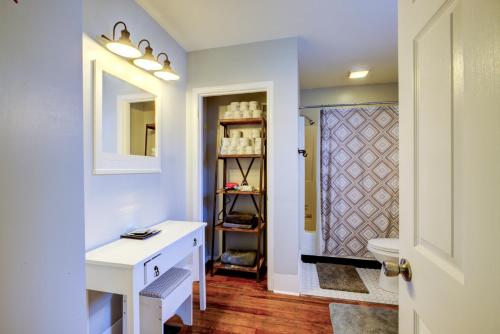 a bathroom with a sink and a toilet and a mirror at Great Location-5 Bd/3 Ba-Near Expo/UL/Fair/YUM/Zoo in Louisville