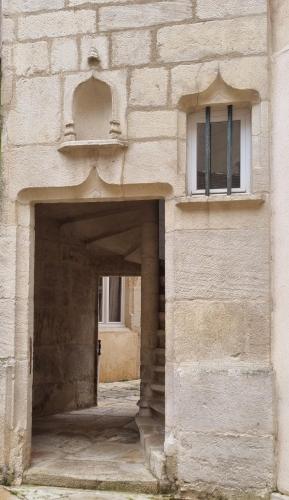 an entrance to a building with a door and a window at L'écrin des petits bonheurs in Dole