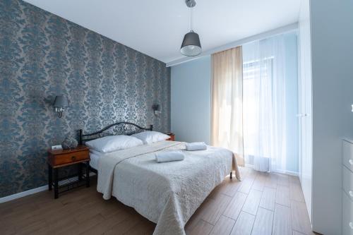 Ένα ή περισσότερα κρεβάτια σε δωμάτιο στο Santorini - Nadmorze