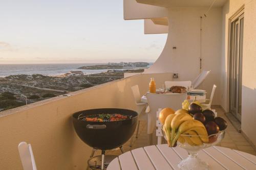 a balcony with a table with a bowl of fruit at Best Houses 64 - Sunset Beach in Ferrel