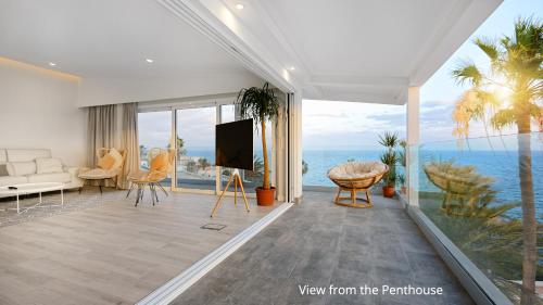 a living room with a view of the ocean at Deva Beach Boutique Apartments in Maspalomas