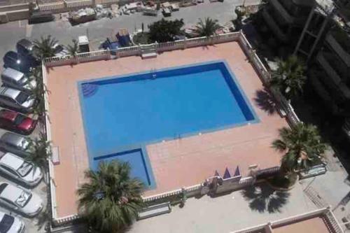 Výhled na bazén z ubytování Precioso apartamento equipado en primera línea nebo okolí