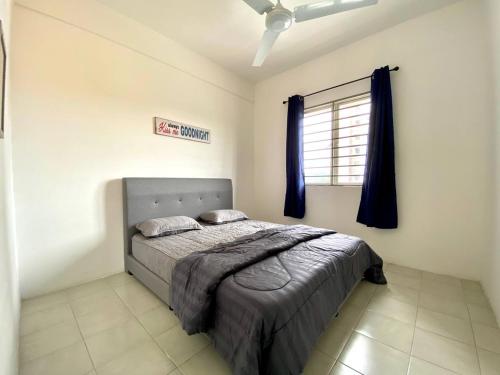 a bedroom with a bed and a window at De'Colour Stay at Country Homes Rawang in Rawang