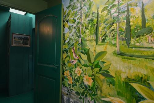 a painting on the wall of a hallway at La BARBELLA in Lourmarin