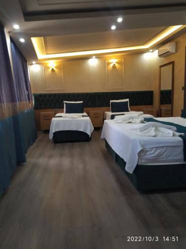 a room with three beds in a room at THE MOSS Hotel in Istanbul