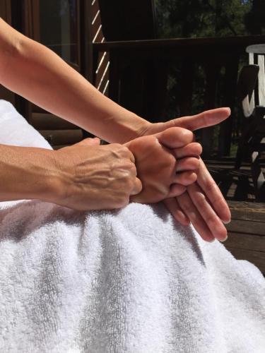 a group of people holding their hands together at Lalapanzi Lodge in Somerset West