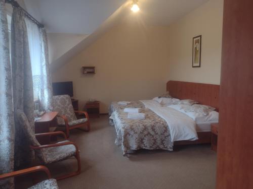 Posteľ alebo postele v izbe v ubytovaní MOTEL ZADOIL ***