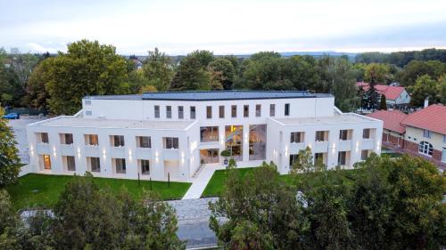 an aerial view of a large white building at Hotel HegiQ - Adults Only Hotel in Hegykő