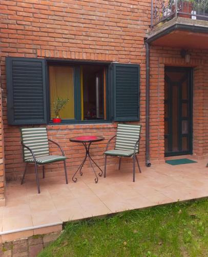 two chairs and a table on a patio at Taras House in Zvezdara