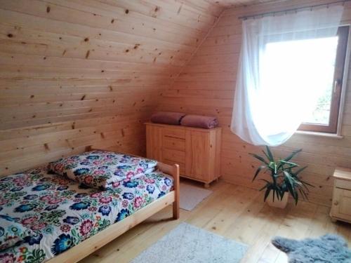 Postel nebo postele na pokoji v ubytování Markowa Chata
