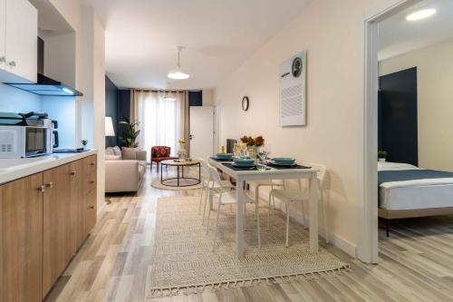 a kitchen and living room with a table in a room at Monnas Suite in Istanbul