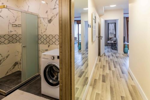 a laundry room with a washer and dryer at Monnas Suite in Istanbul