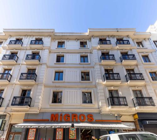 a large white building with a sign on it at Monnas Suite in Istanbul