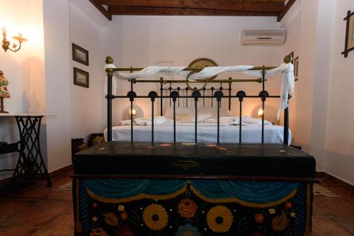 a bedroom with a bed in a room at Eros Pittoresque Retreats - Perfect location, Panoramic Seaview in Koroni