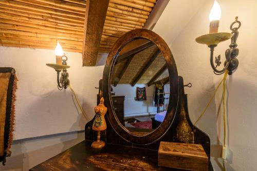 a mirror on a table in a room at Eros Pittoresque Retreats - Perfect location, Panoramic Seaview in Koroni