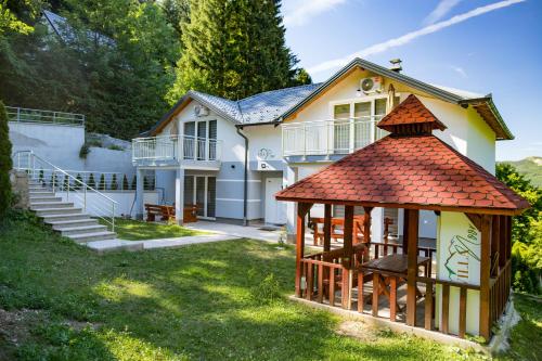 a house with a gazebo in the yard at Villa Noor in Sarajevo