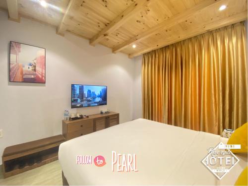 TV a/nebo společenská místnost v ubytování Riverside Mini Hotel Grand World Phu Quoc