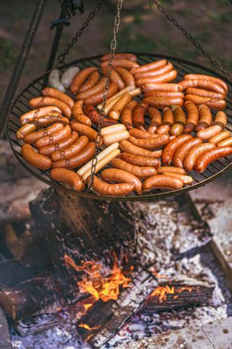 a bunch of hot dogs cooking on a grill at Pałac Chichy in Małomice