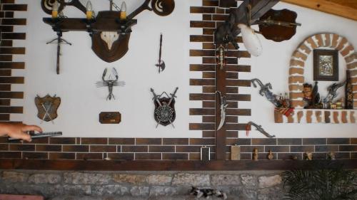 a wall with a bunch of antiques on it at Albena Guest House in Shabla